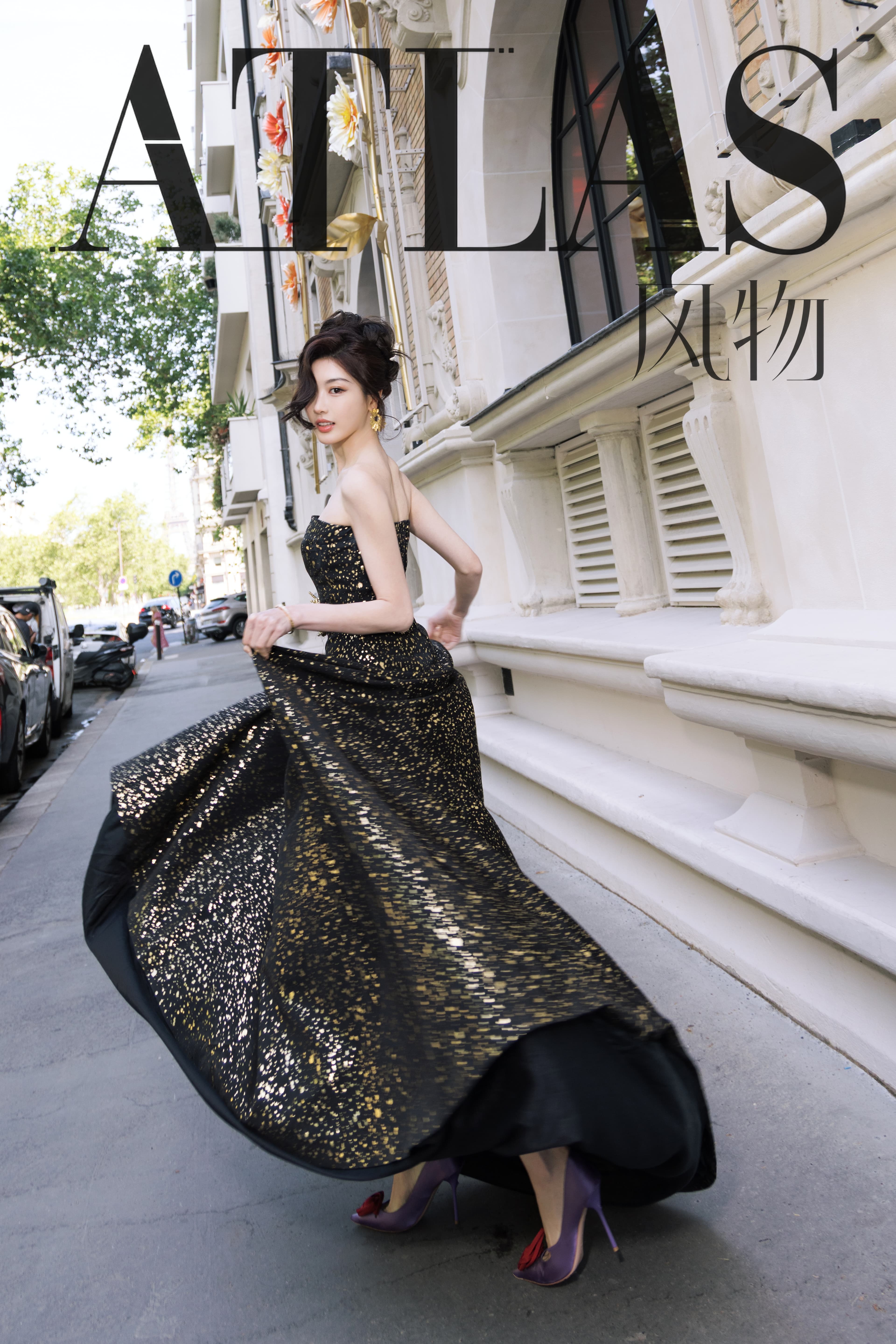 Sun Leyan in a black-and-gold dress on a Paris street for ATLAS Issue 01.
